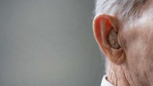 close-up on elderly man’s hearing aid