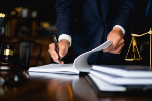 lawyer signing papers