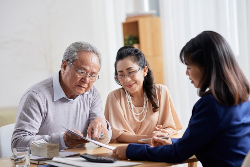 elderly couple discussing financial options