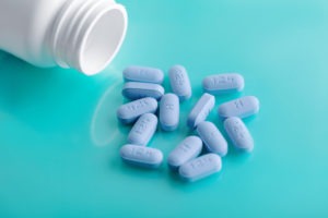 bottle with truvada pills spilled out