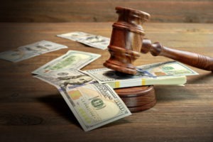 gavel and money in a courtroom