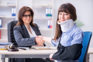 injured person speaking with a lawyer