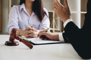 a woman consults with her lawyer