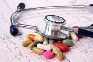 Oral medications with a medical chart and stethoscope