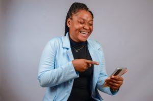 confident lady smiling at phone
