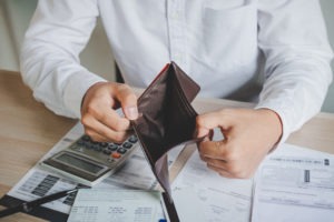 man holding open empty wallet