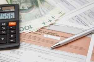 calculator and pen with loan documents