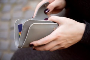 woman opening wallet
