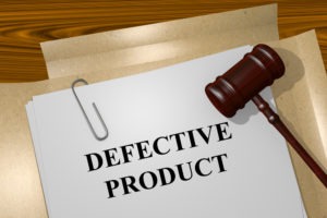 gavel with defective product written on a folder