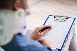 person filling out a slip-and-fall form