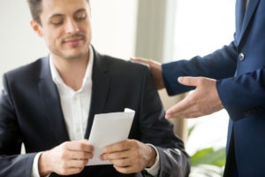 man happy to open his settlement check