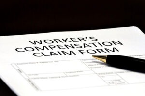 workers compensation claim form with pen