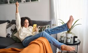 woman happy to see loan cleared on her phone