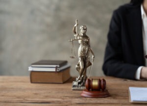 Judge gavel with Justice lawyers, Businesswoman in suit or lawyer working on a documents. Legal law, advice and justice concept.